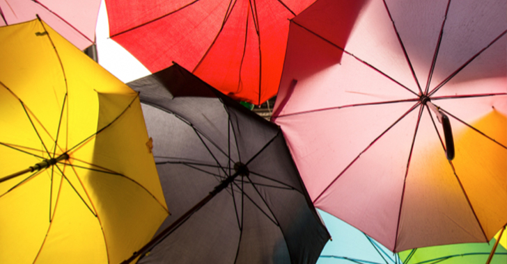 Several open, colourful umbrellas 