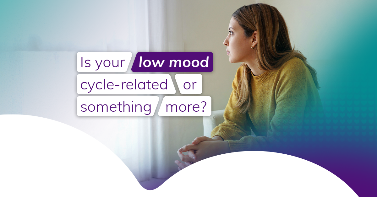 A woman with brown hair wearing a yellow jumper looks out her window with clasped hands