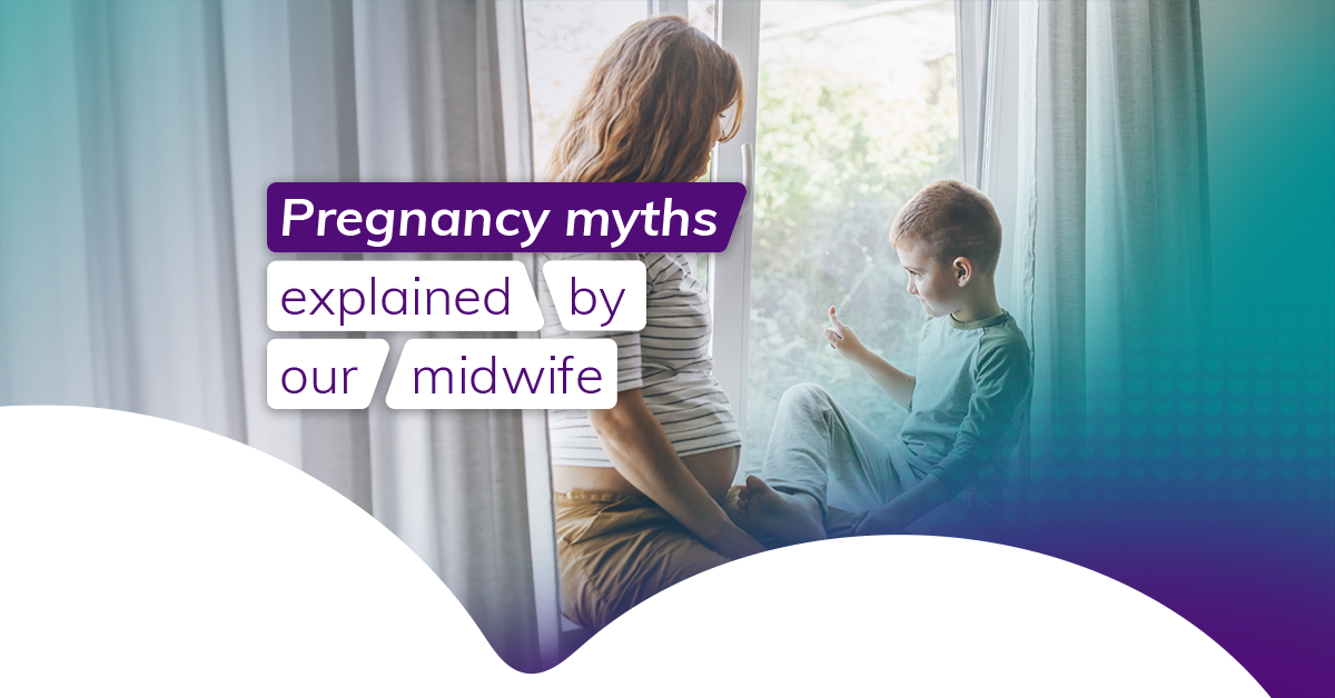 A pregnant mother sits on a window sill with her young son. She's wearing brown trousers and a striped top. Her son is wearing cream trousers and a green top. He's pointing at something out the window. 