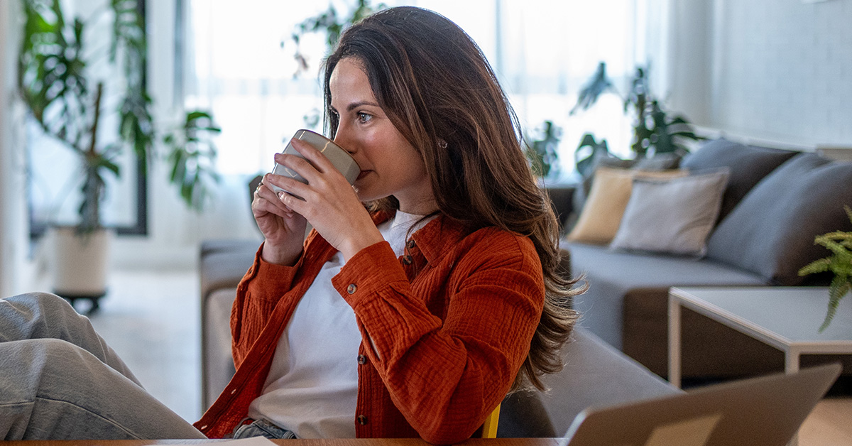 A woman enjoying a coffee as self care
