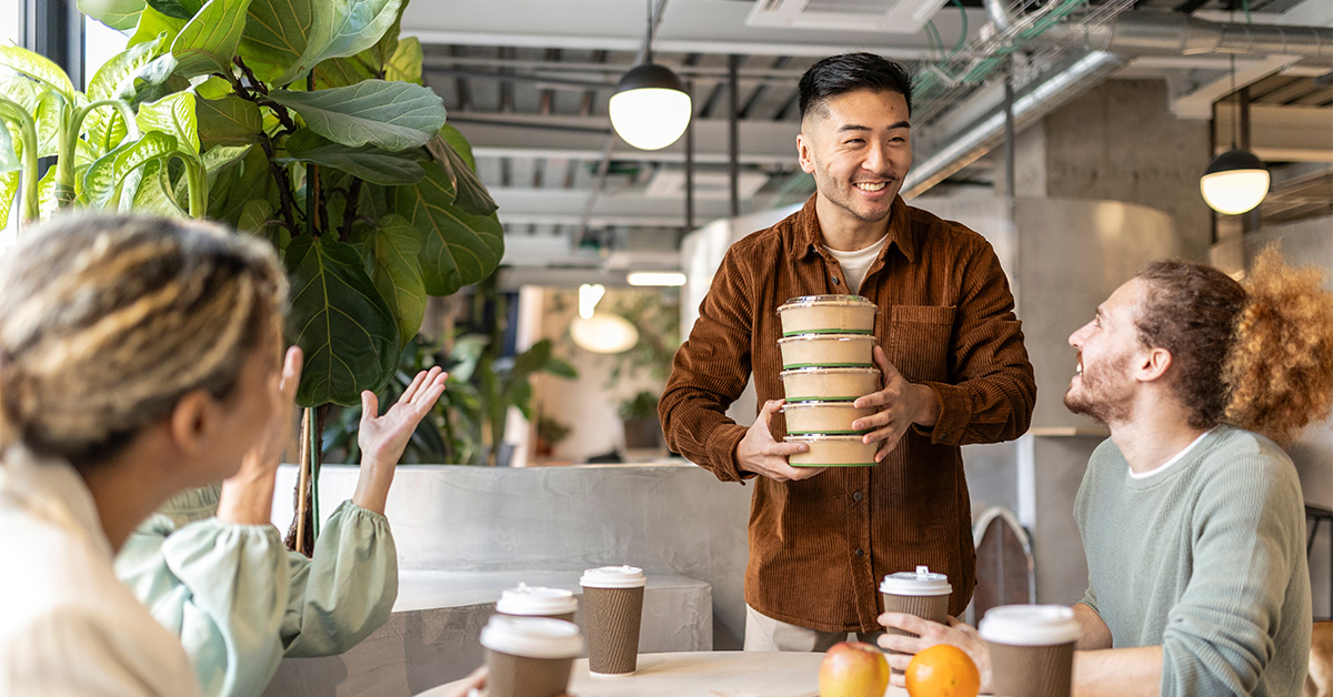 One employee bringing food for his colleagues at work