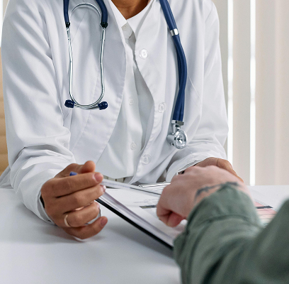 Hands on desk during a medical consultation