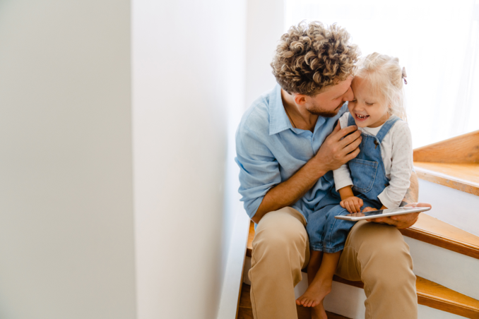 Man with child on stairs