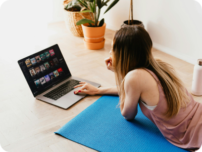 Woman using laptop on the floor