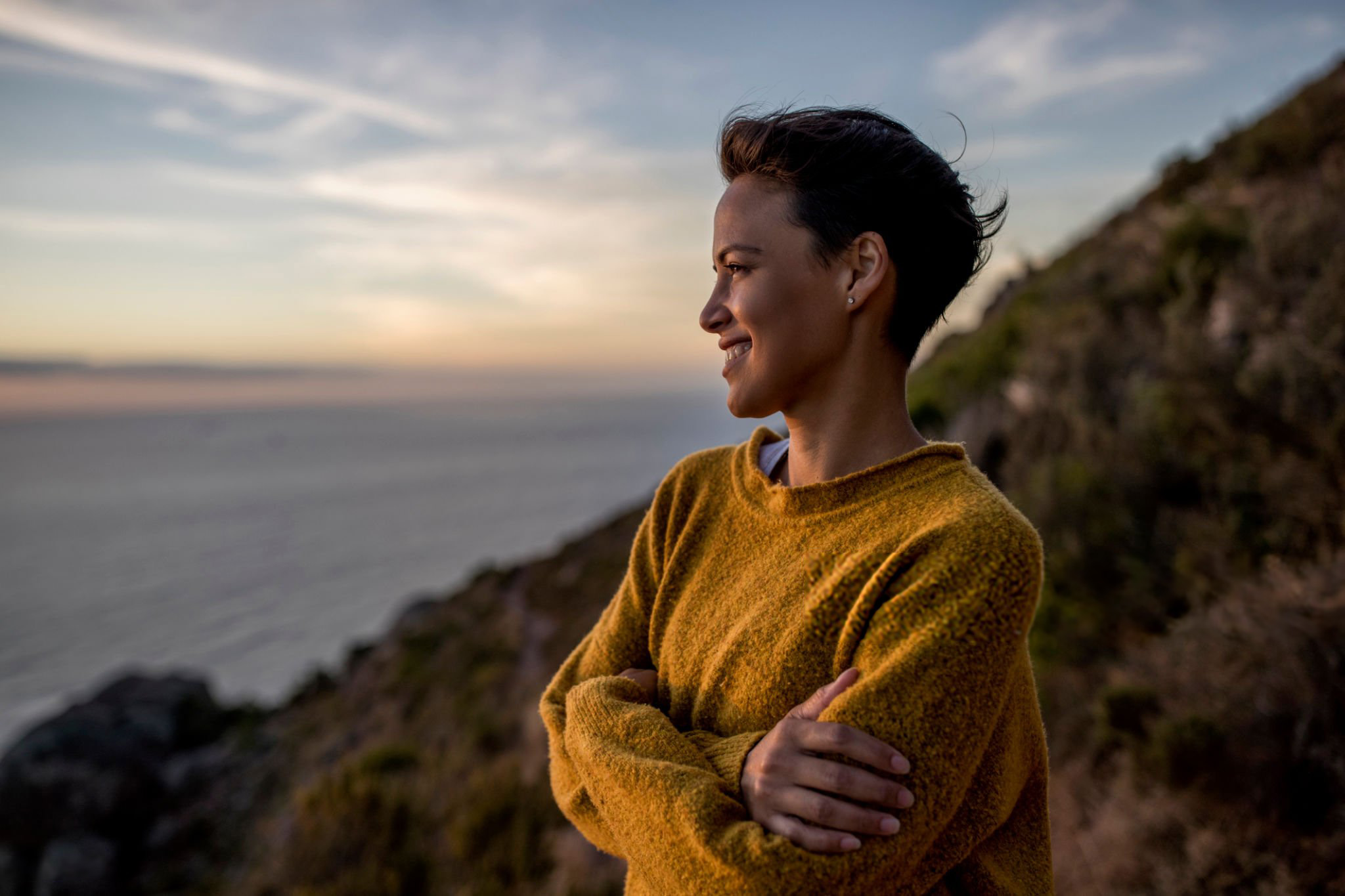 Woman smiling looking at sea view